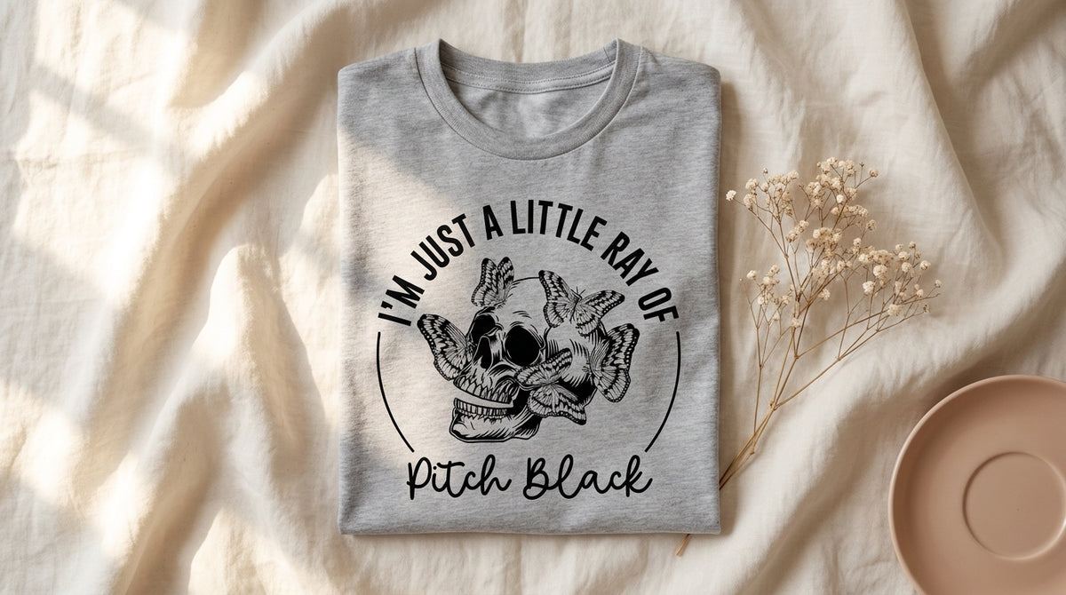 Athletic heather I'm Just A Little Ray Of Pitch Black tee flat lay on rumpled ivory linen with dried baby's breath – Peachy Sunday Journal autumn introvert lifestyle