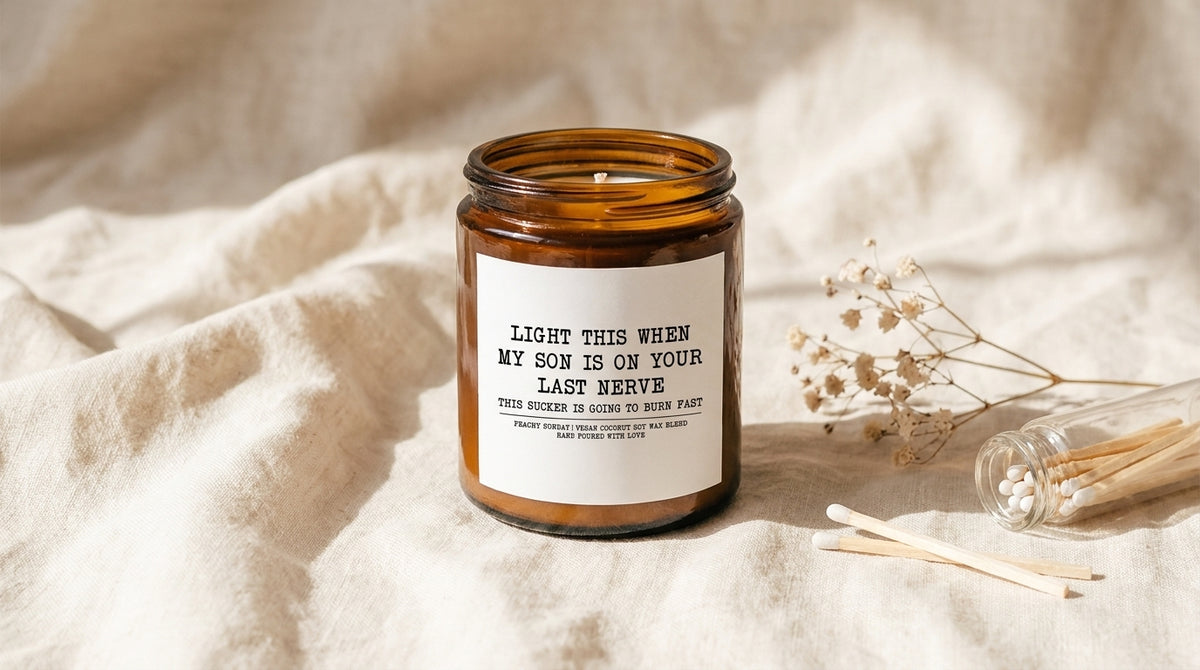 Light This When My Son Is On Your Last Nerve amber glass candle on ivory linen with baby's breath sprig – Peachy Sunday daughter in law gifts