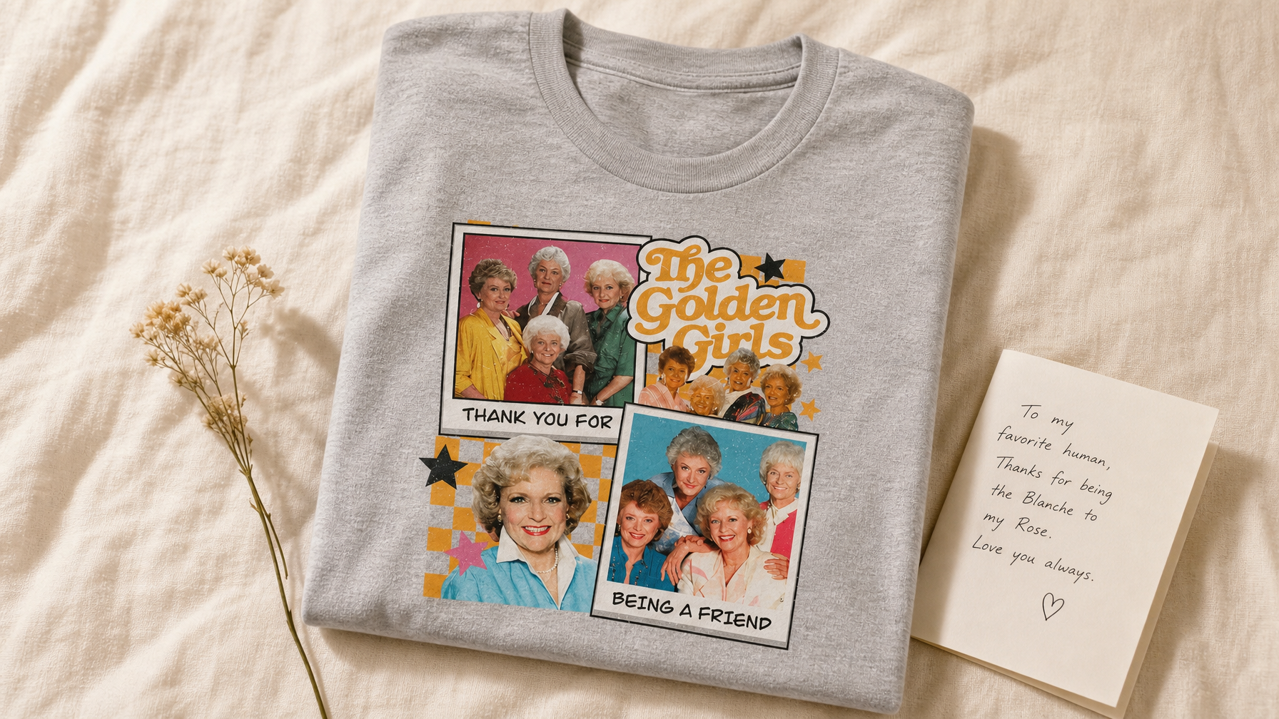 Athletic heather Thank You For Being A Friend graphic tee with dried flowers and a handwritten card on warm cream linen, UGC flat lay