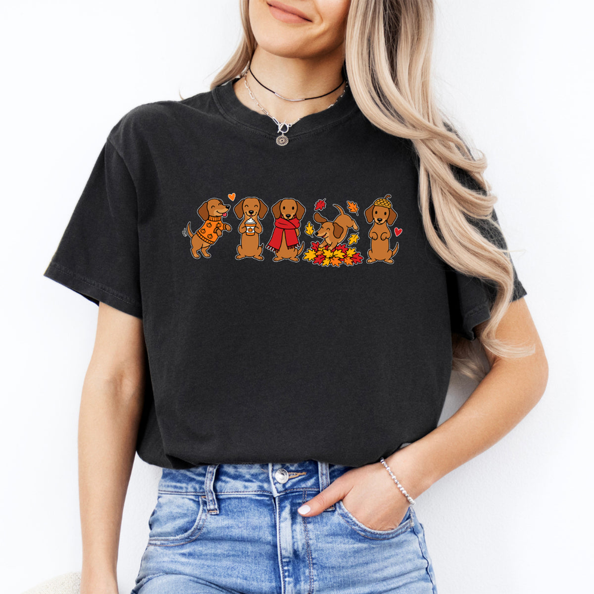 Autumn dachshund dogs in sweaters and fall leaves graphic tee in black