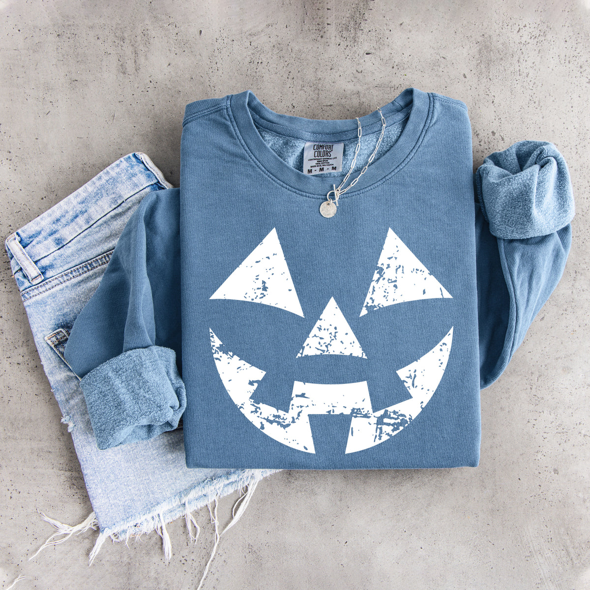 Sudadera con cara de calabaza desgastada