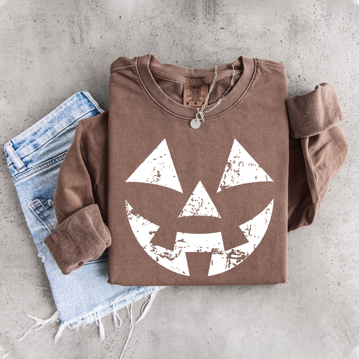 Sudadera con cara de calabaza desgastada