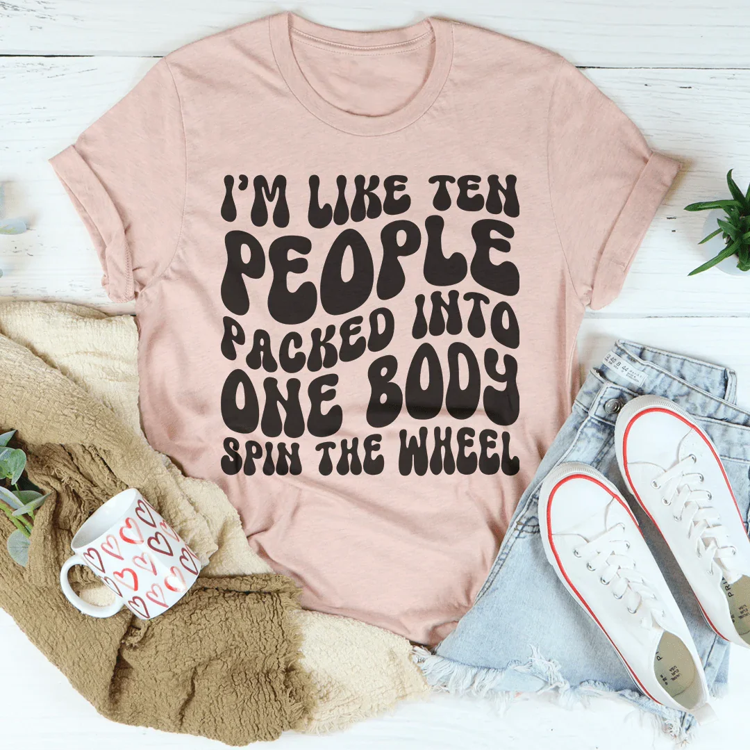 I’m Like Ten People Packed Into One Body Spin The Wheel Tee Heather Prism Peach / S Peachy Sunday T-Shirt