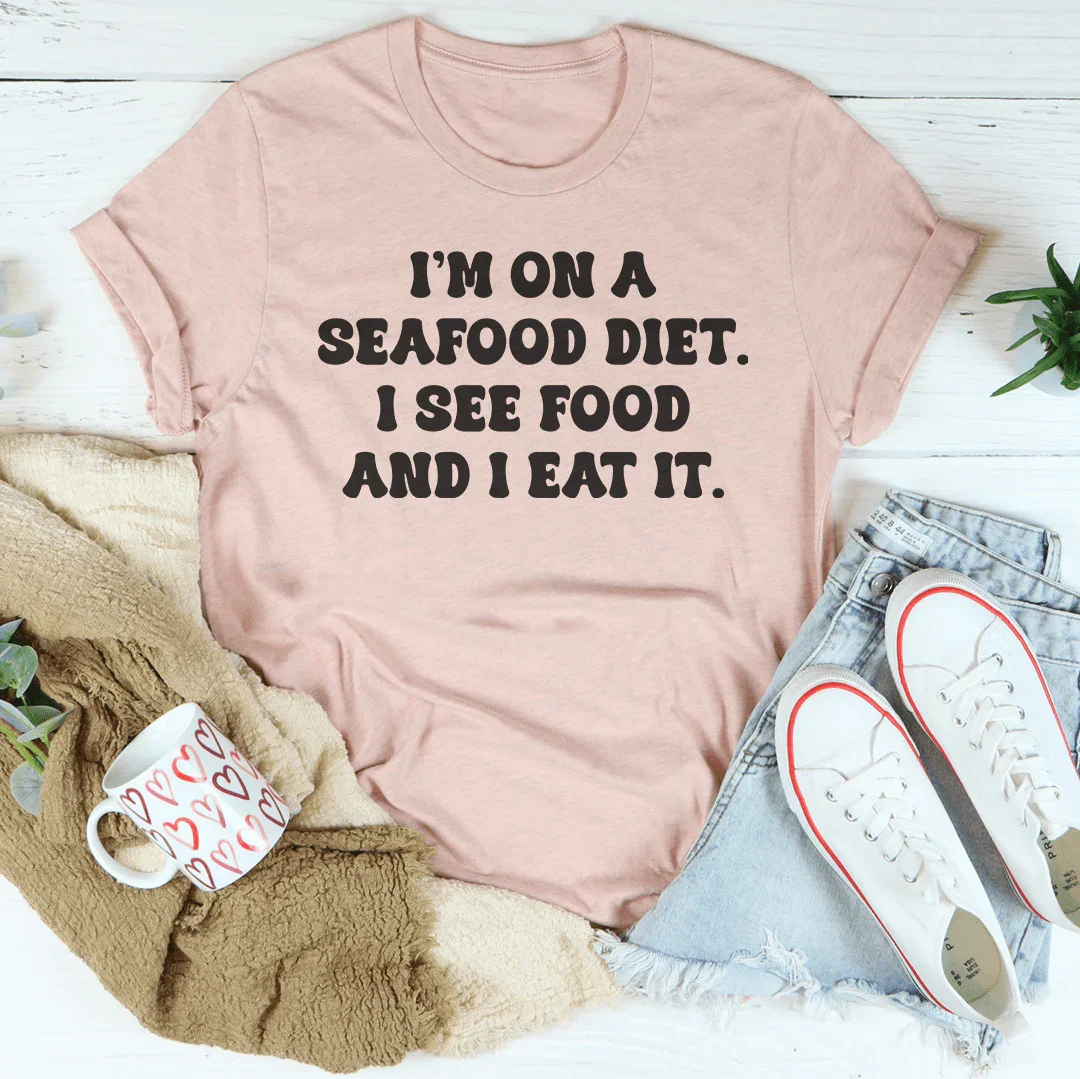 I’m On A Seafood Diet I See Food And I Eat It Tee Heather Prism Peach / S Peachy Sunday T-Shirt