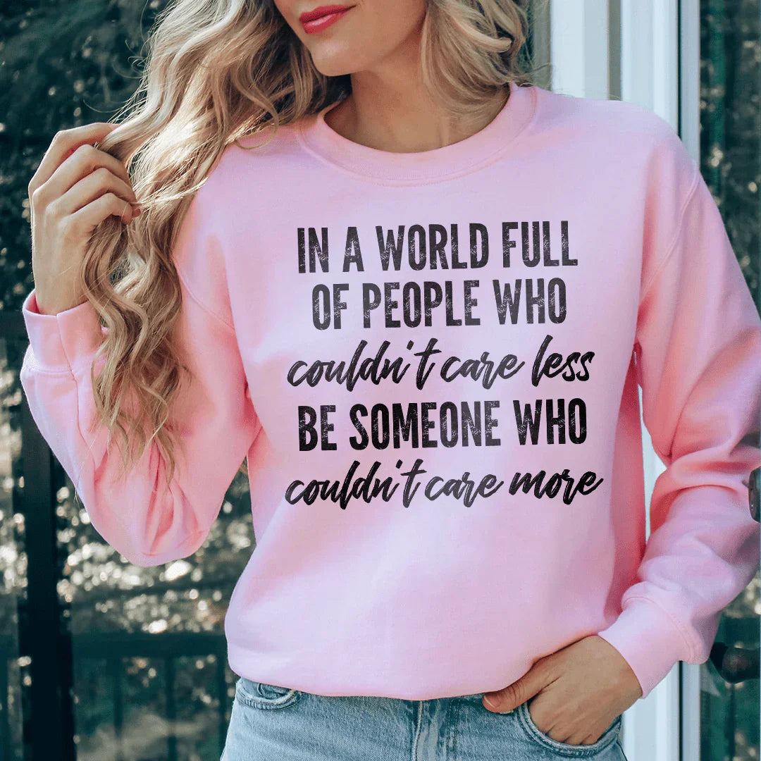 In A World Full Of People Who Couldn't Care Less Be Someone Sweatshirt Light Pink / S Peachy Sunday T-Shirt