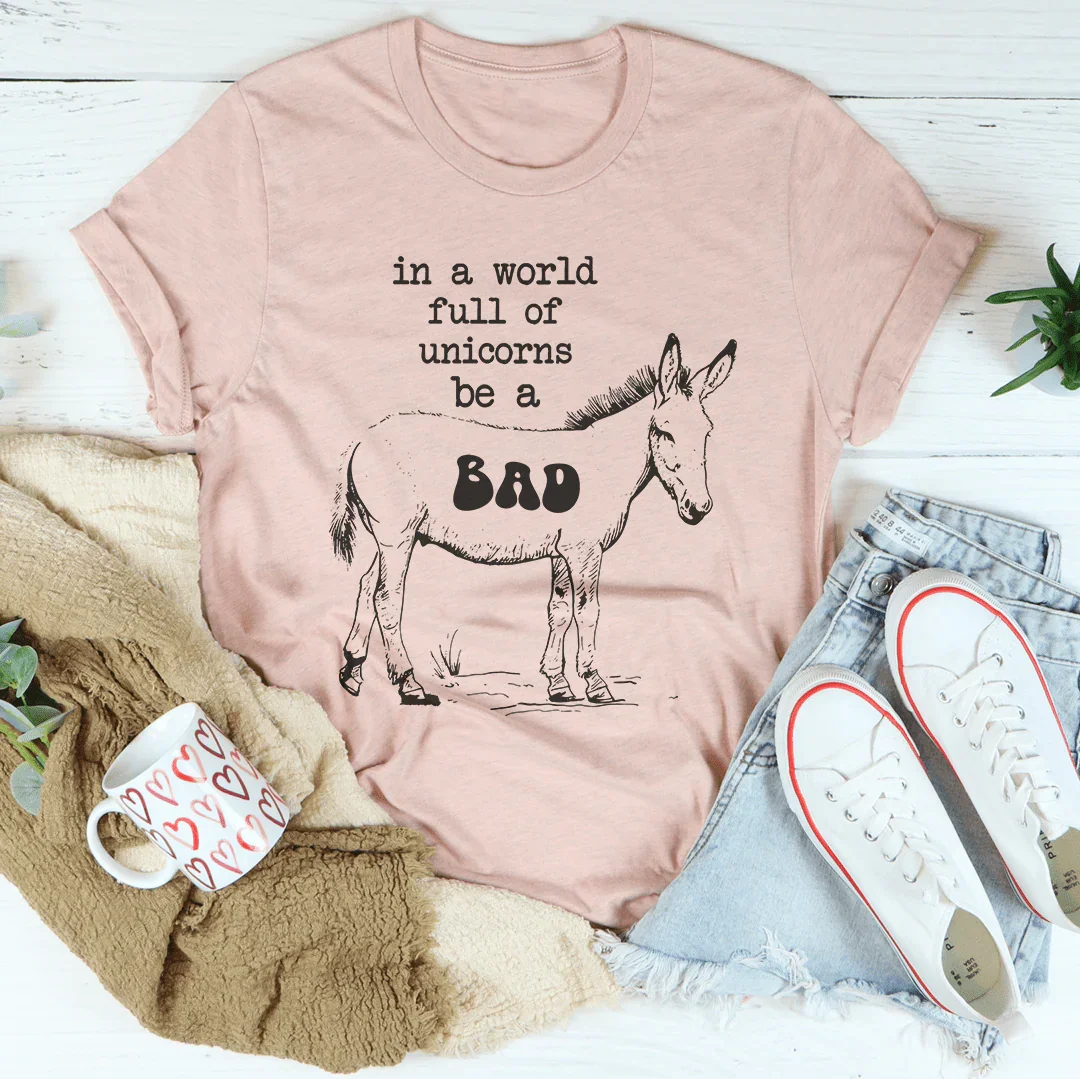 In A World Full Of Unicorns Be A Bad Tee Heather Prism Peach / S Peachy Sunday T-Shirt