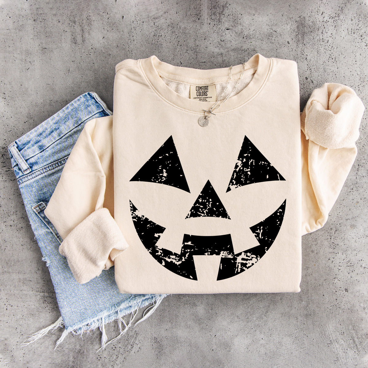 Sudadera con cara de calabaza desgastada