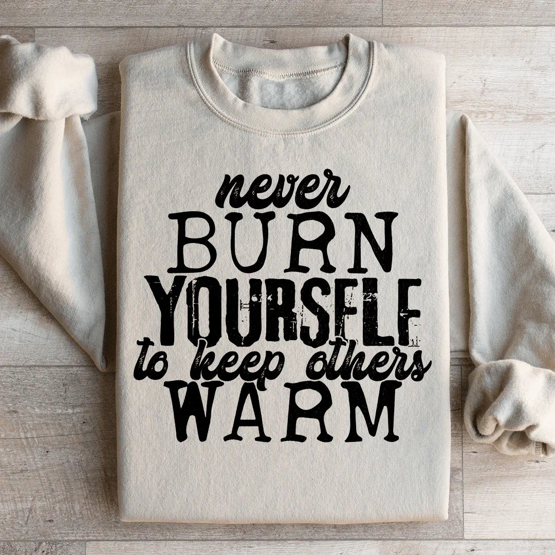 Never Burn Yourself To Keep Others Warm Sweatshirt Sand / S Peachy Sunday T-Shirt