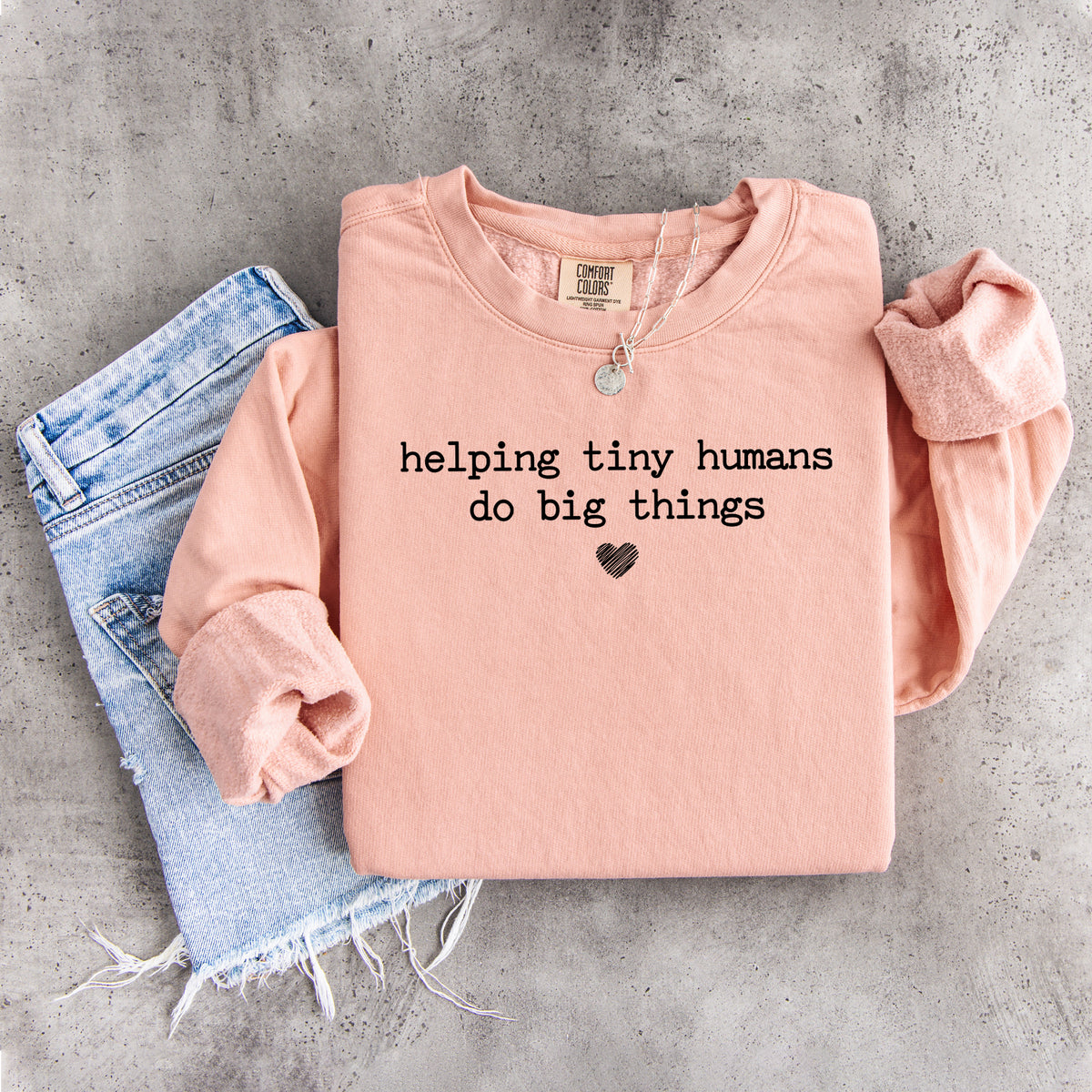 Sweatshirt „Kleinen Menschen helfen, große Dinge zu tun“