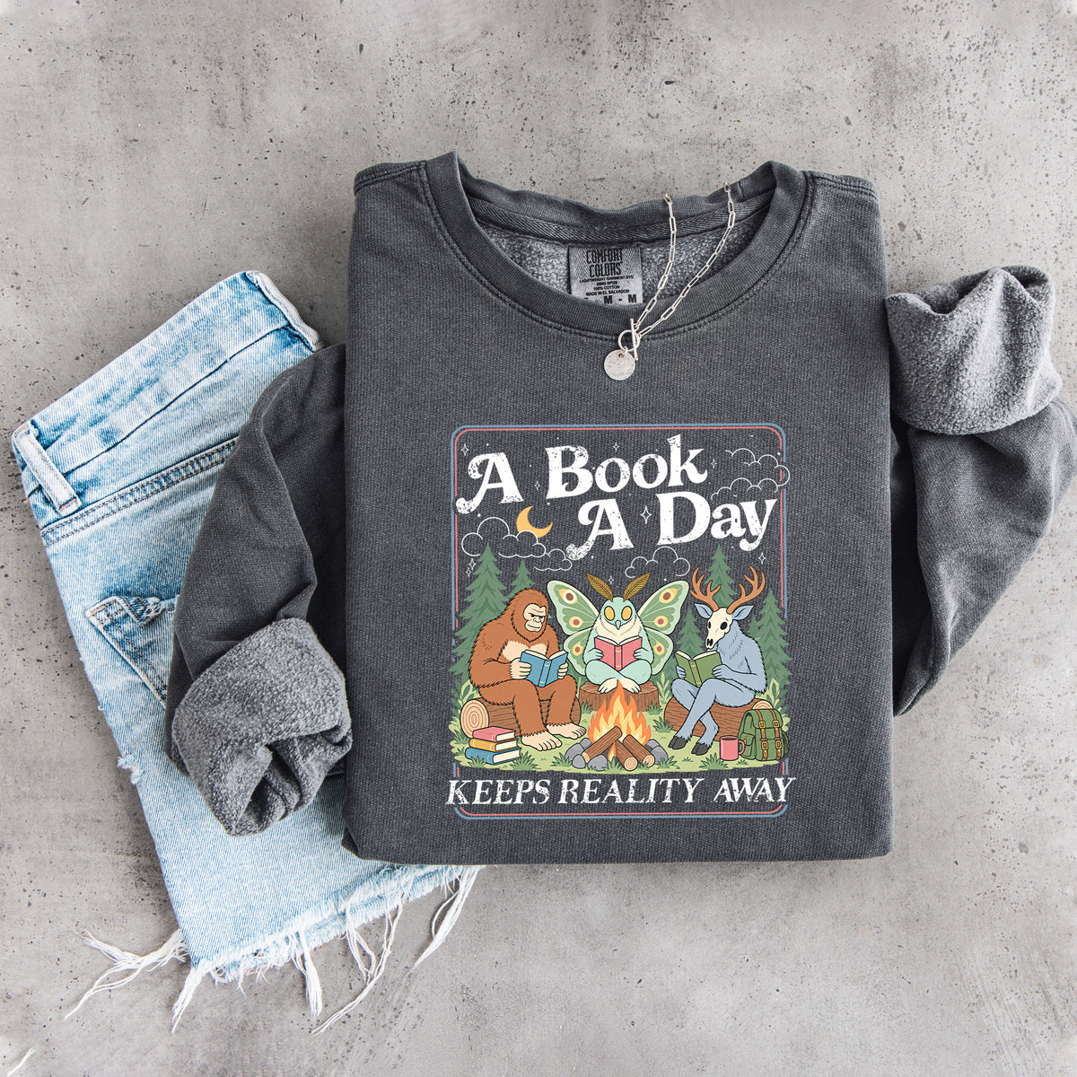 Ein Buch am Tag hält die Realität fern – Sweatshirt