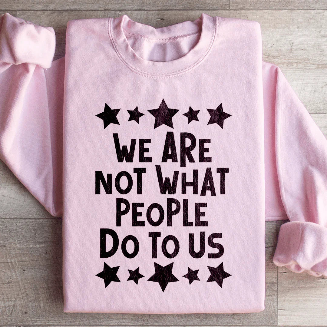 We Are Not What People Do To Us Sweatshirt Light Pink / S Peachy Sunday T-Shirt