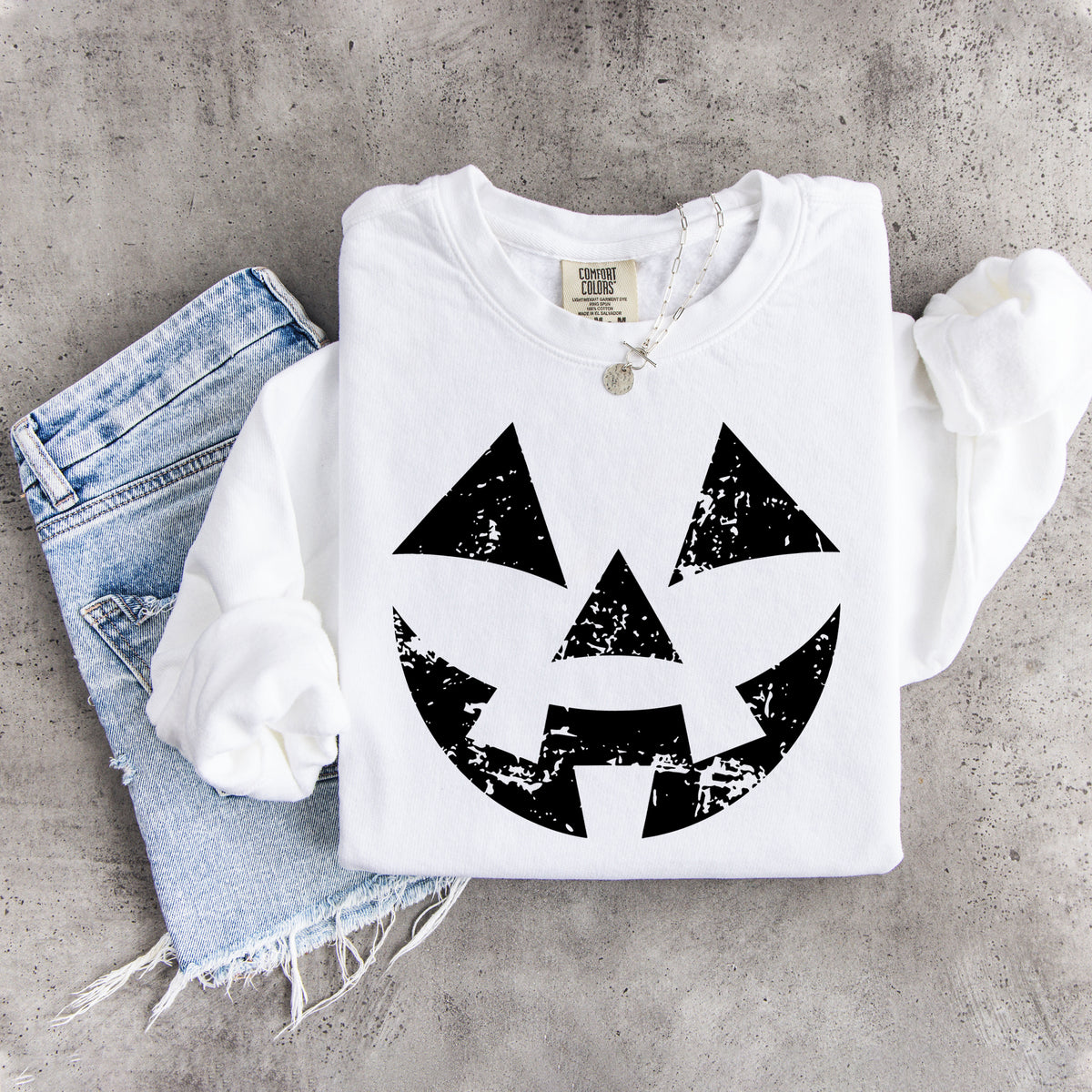 Sudadera con cara de calabaza desgastada