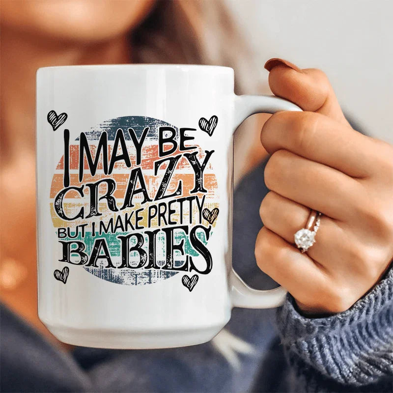 I May Be Crazy But I Make Pretty Babies Ceramic Mug 15 oz White / One Size CustomCat Drinkware T-Shirt