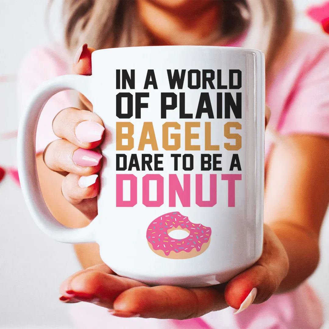 In A World Of Plain Bagels Ceramic Mug 15 oz White / One Size CustomCat Drinkware T-Shirt