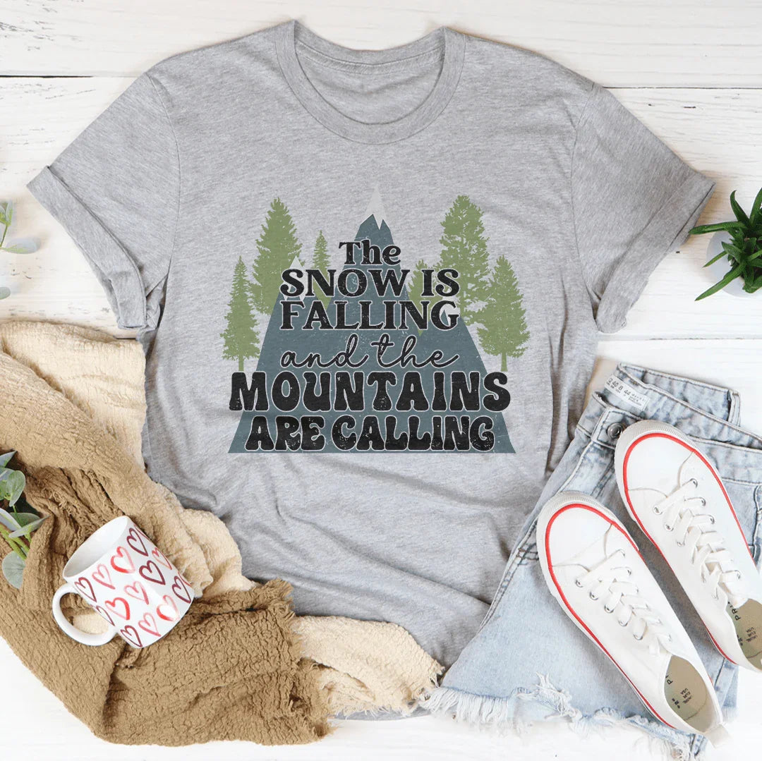 The Snow Is Falling And The Mountains Are Calling Tee Peachy Sunday T-Shirt