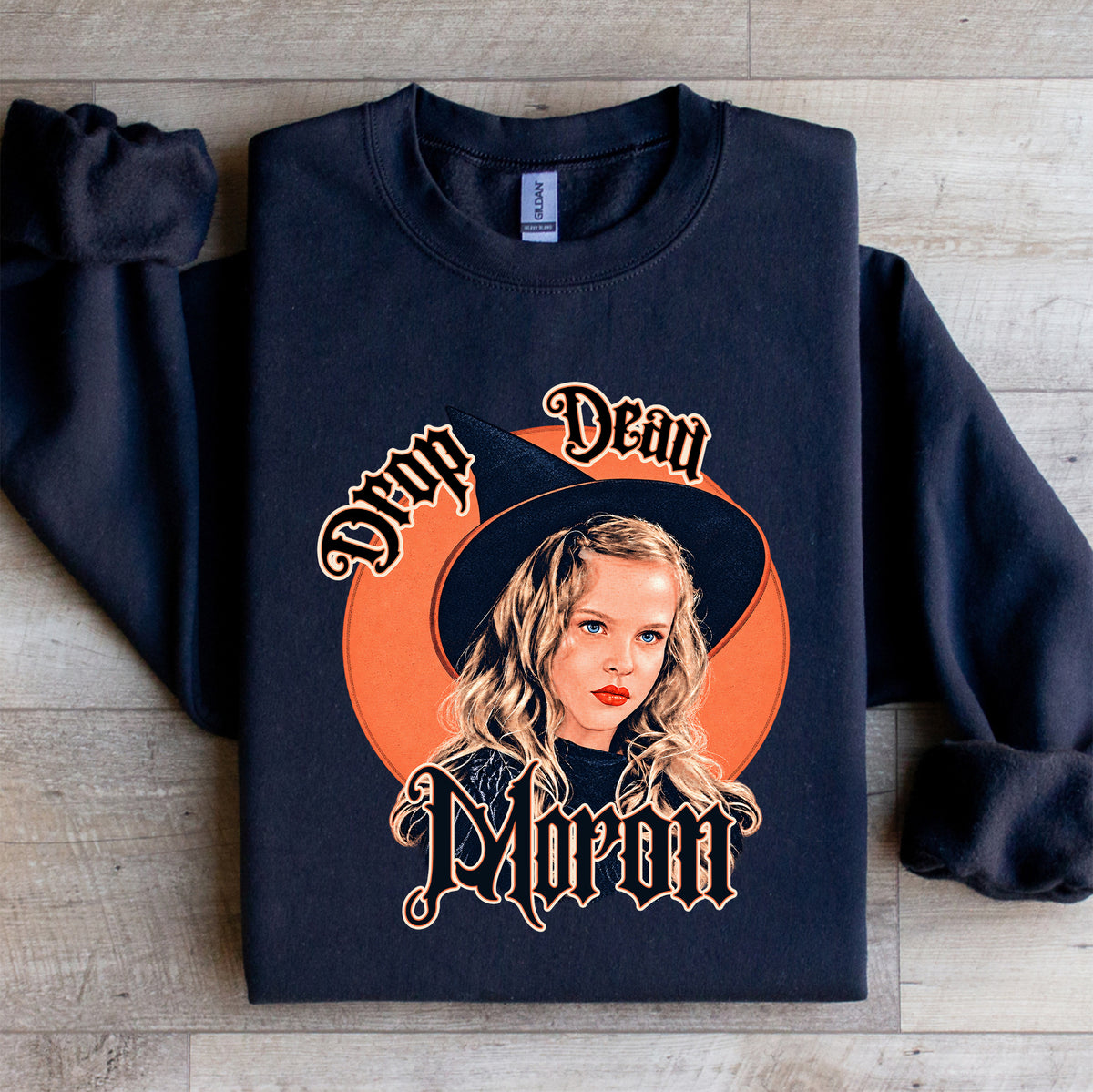 Vintage 90s witch movie crewneck sweatshirt featuring Drop Dead Moron gothic typography and vintage witch portrait art on black fleece