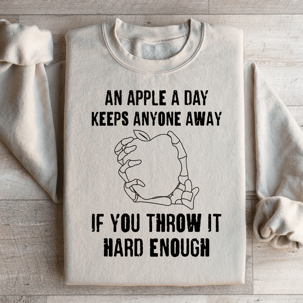 An Apple A Day Keeps Anyone Away If You Throw It Hard Enough Sweatshirt Sand / S Peachy Sunday T-Shirt