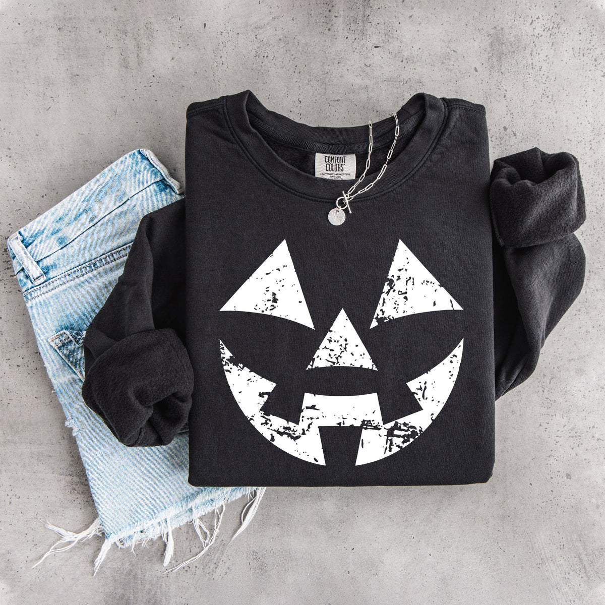 Sudadera con cara de calabaza desgastada