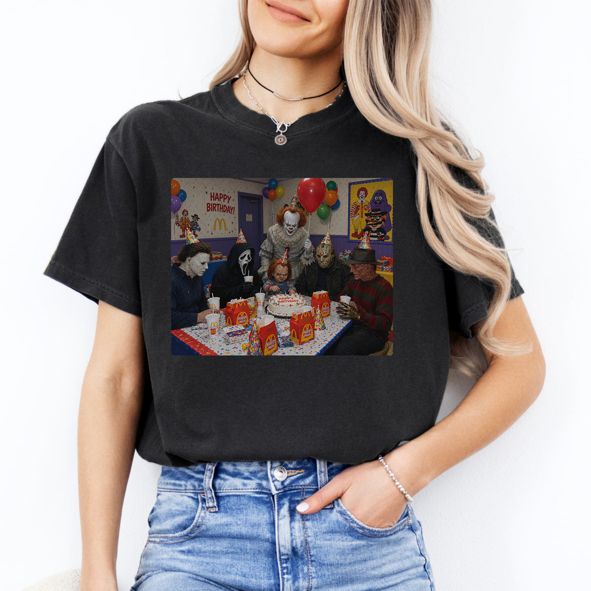Nostalgic 90s horror movie graphic tee featuring vintage slasher movie birthday party with cake and party hats on black cotton shirt