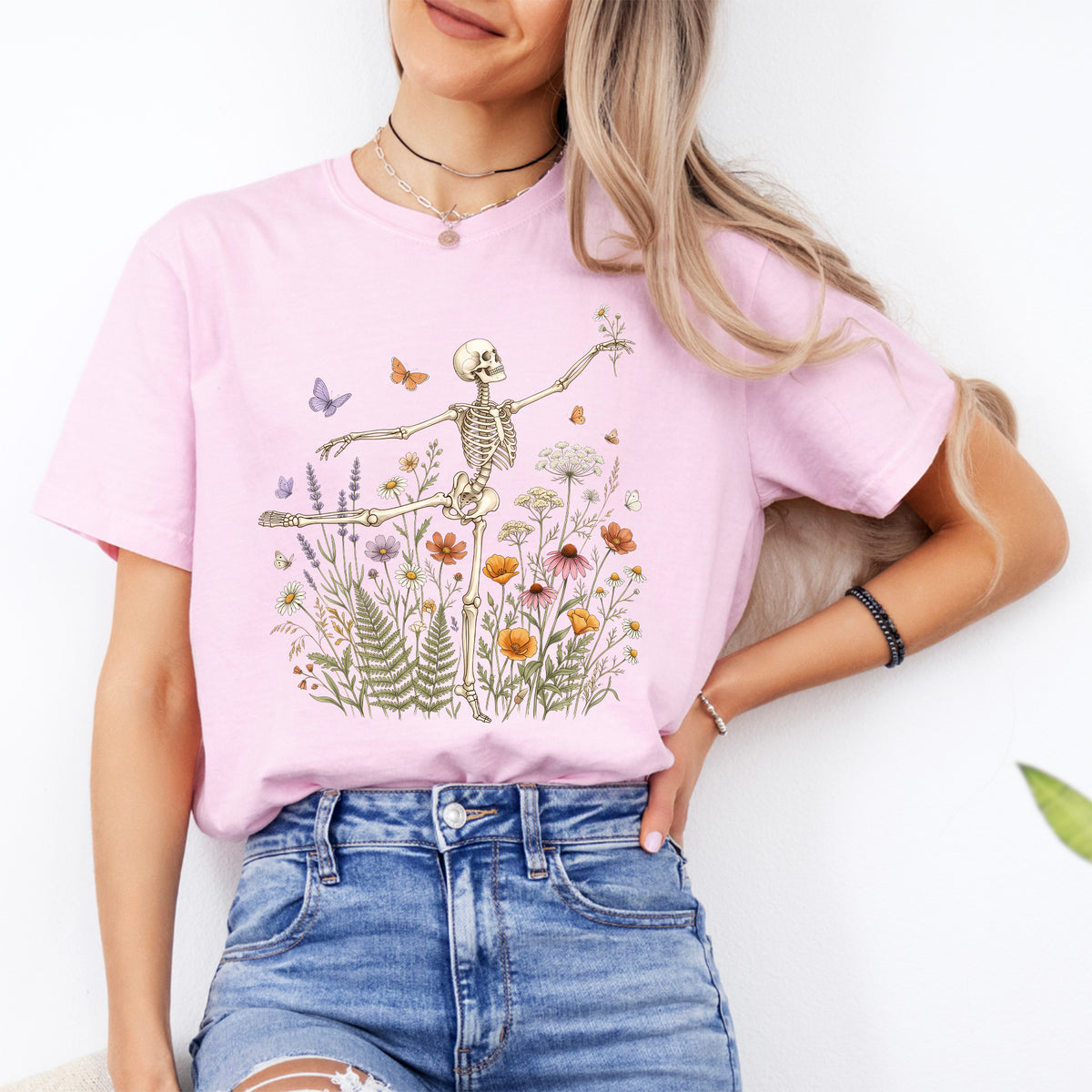 Dancing skeleton arabesque ballet in blooming wildflower meadow graphic tee in blossom pink