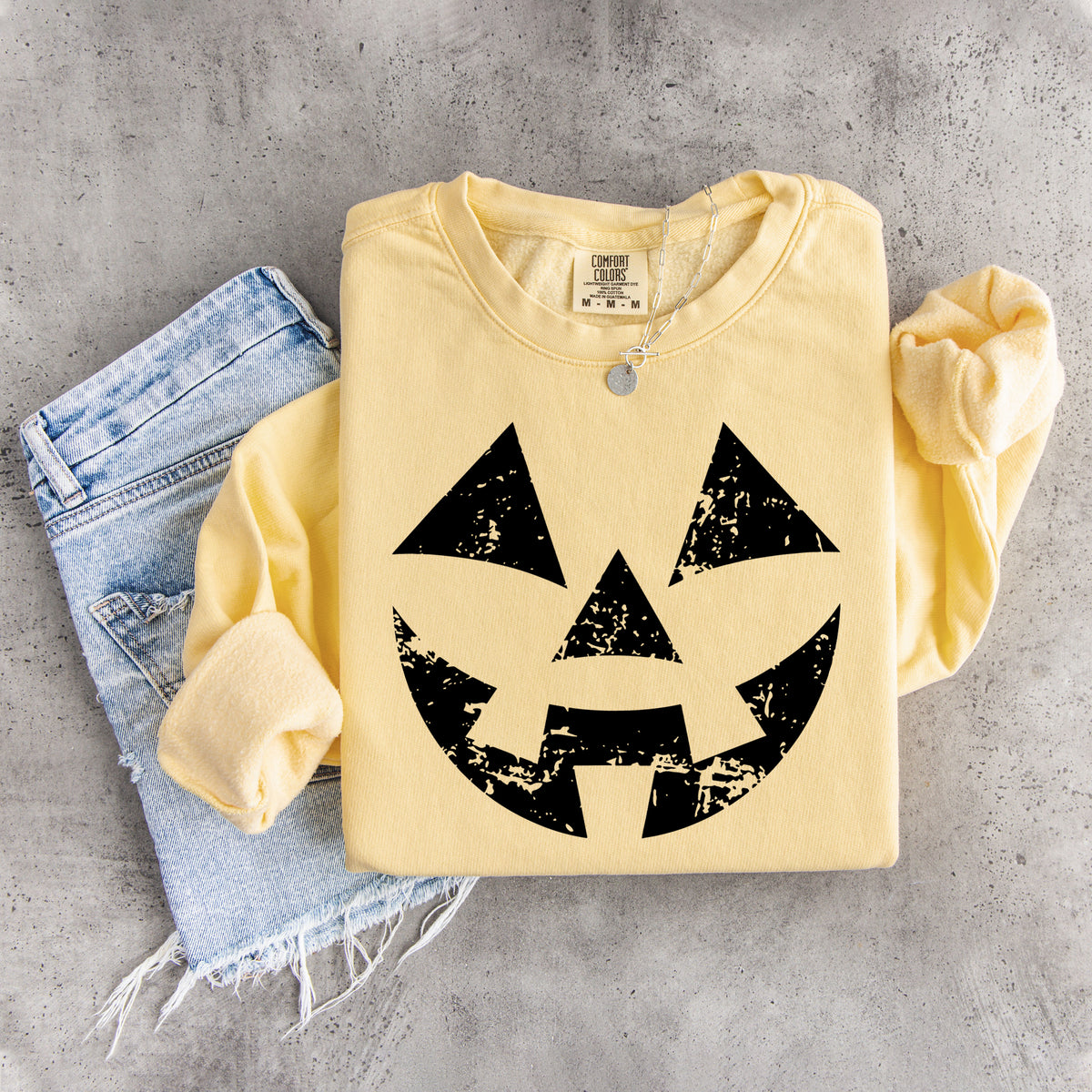 Sudadera con cara de calabaza desgastada