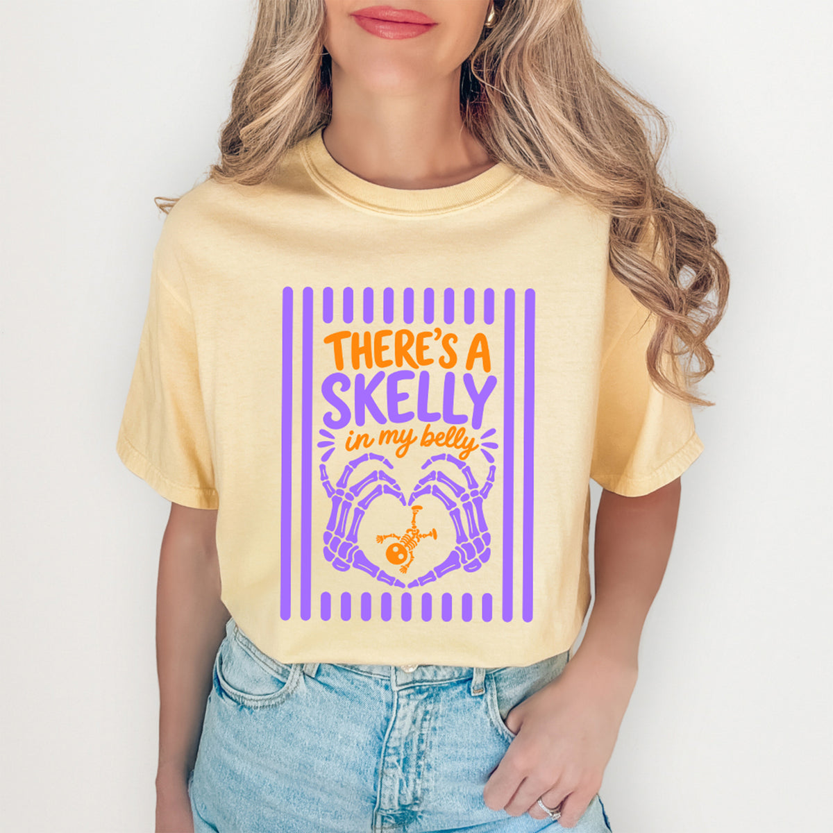 Funny spooky skeleton baby bump pregnancy reveal tee in butter yellow