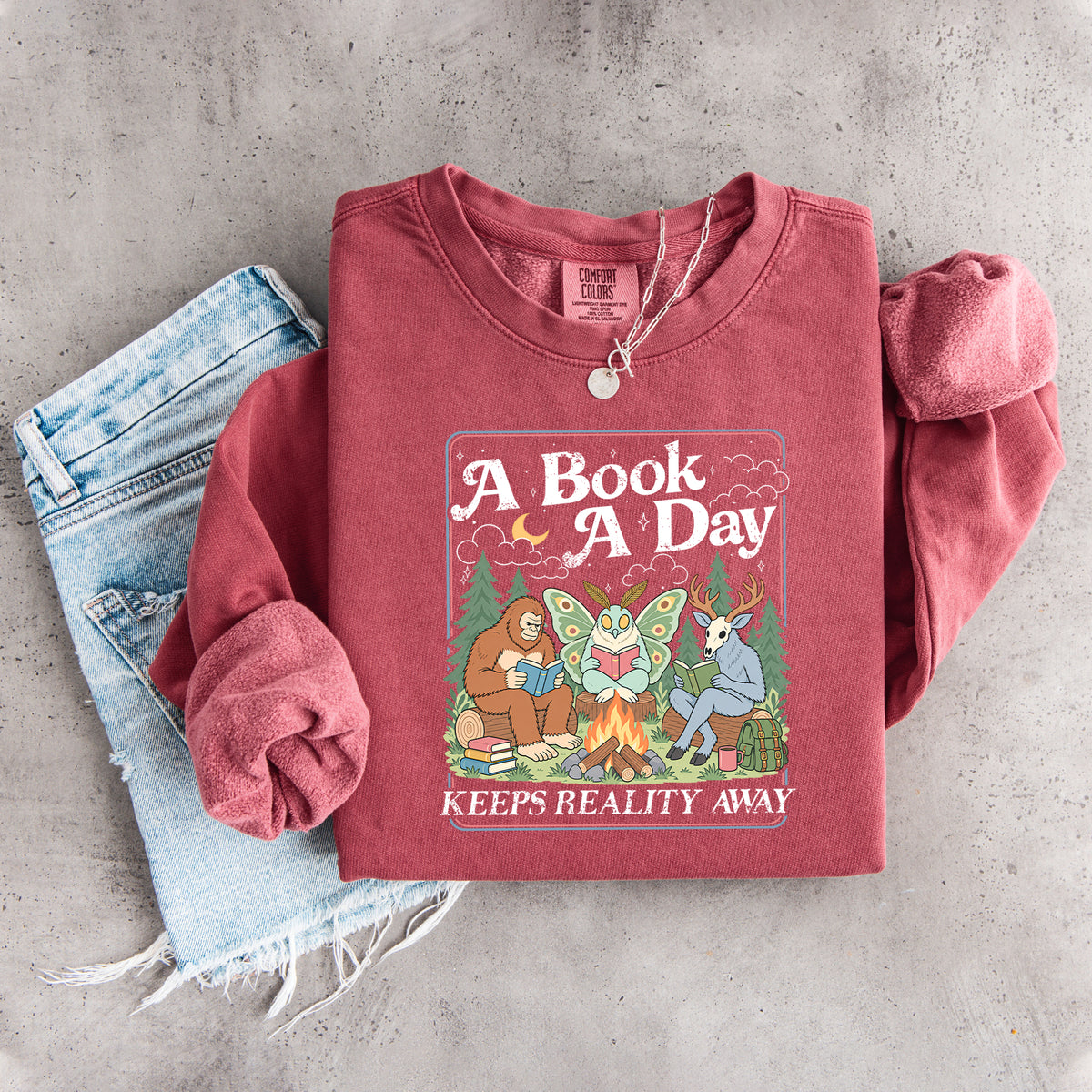 Ein Buch am Tag hält die Realität fern – Sweatshirt