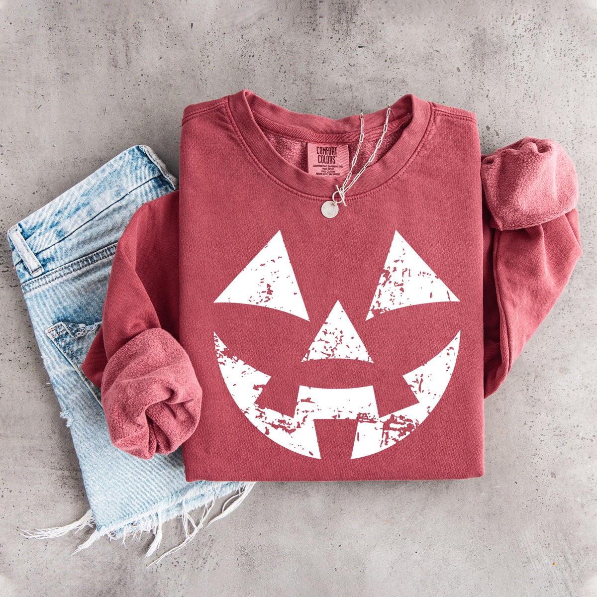 Sudadera con cara de calabaza desgastada