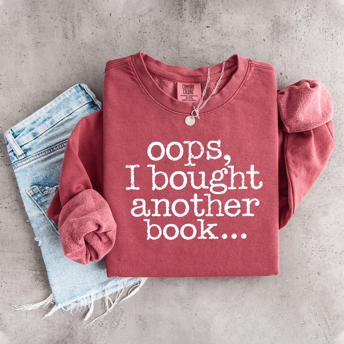 „Ups, ich habe noch ein Buch gekauft …“ – humorvolles Sweatshirt für Bücherwürmer