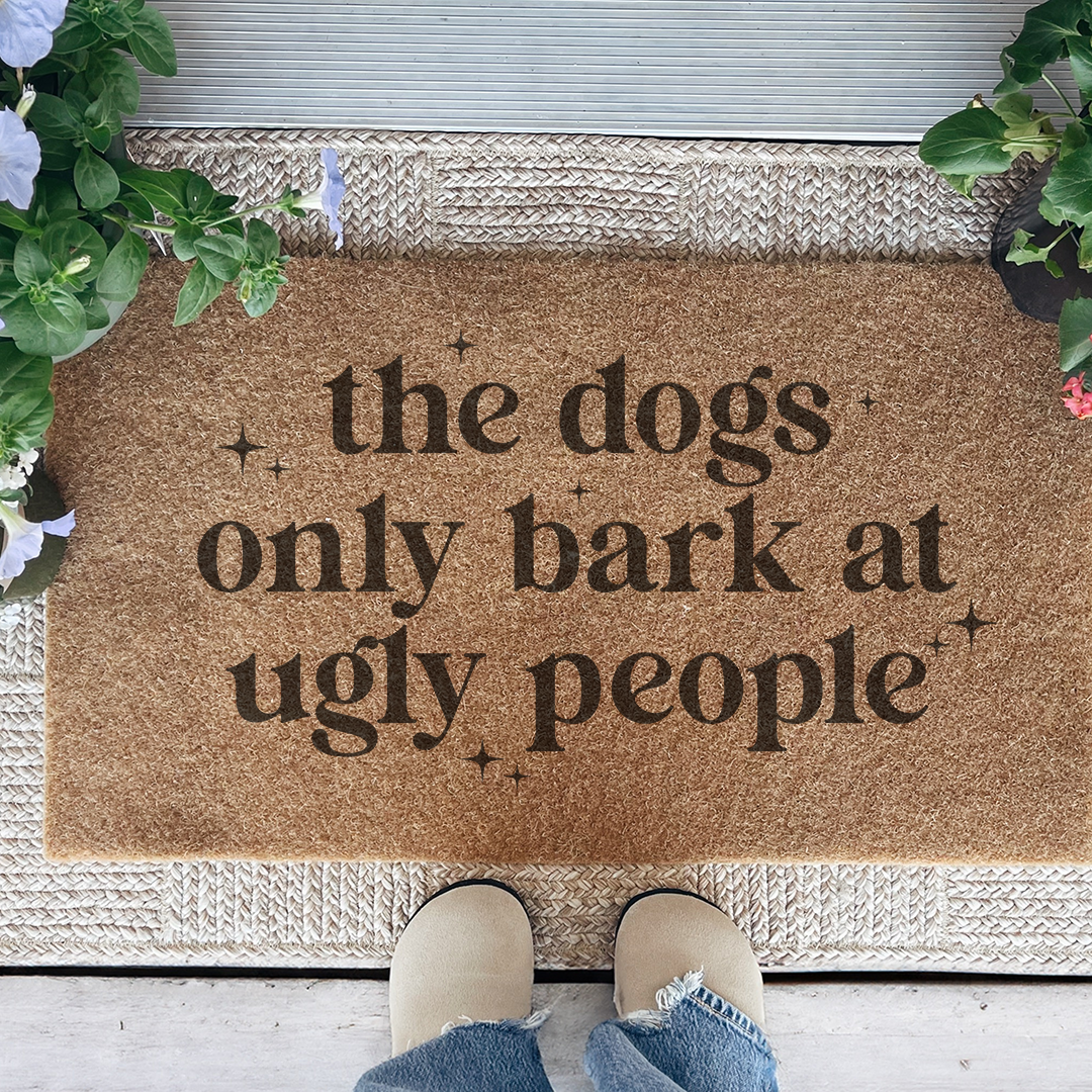 The Dogs Only Bark At Ugly People Doormat