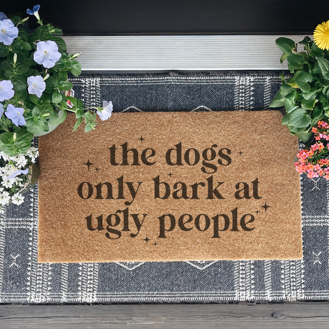 The Dogs Only Bark At Ugly People Doormat