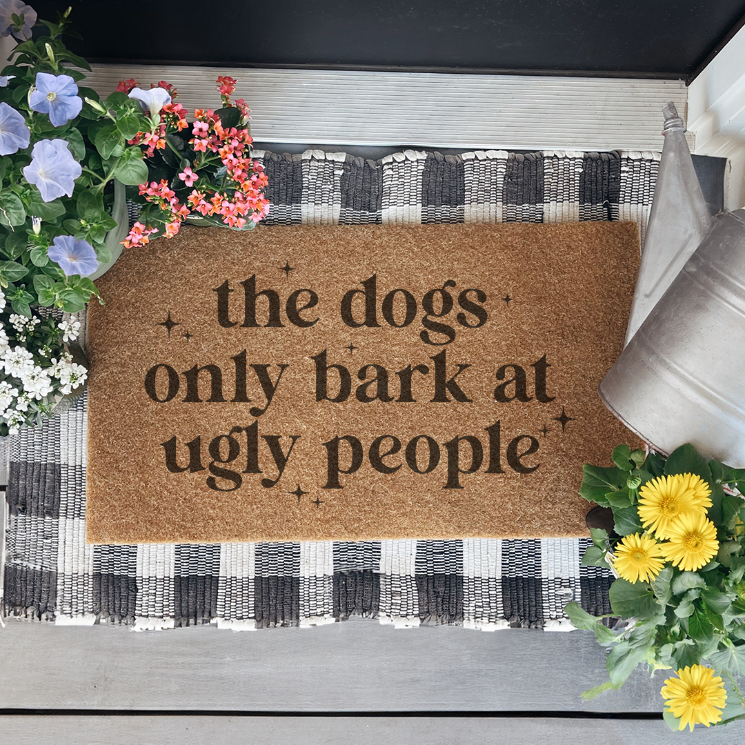 The Dogs Only Bark At Ugly People Doormat