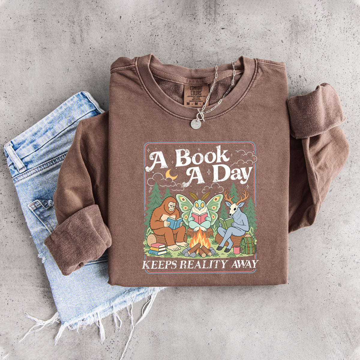 Ein Buch am Tag hält die Realität fern – Sweatshirt