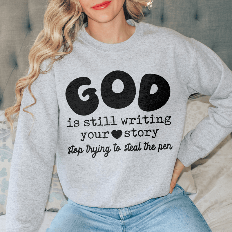 God Is Still Writing Your Story Stop Trying To Steal The Pen  Sweatshirt Sport Grey / S Peachy Sunday T-Shirt