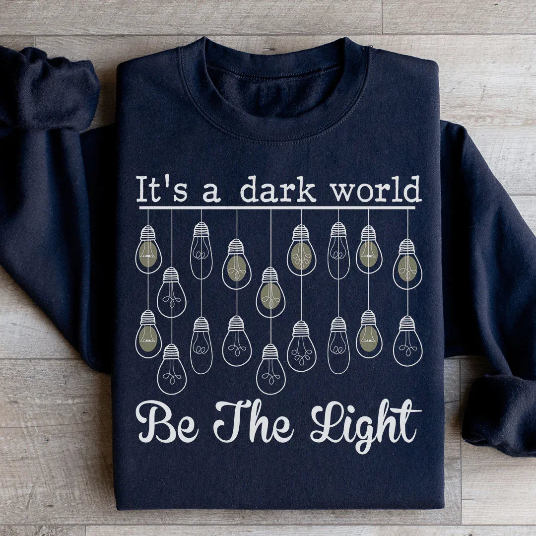 It's A Dark World Be The Light Sweatshirt Black / S Peachy Sunday T-Shirt