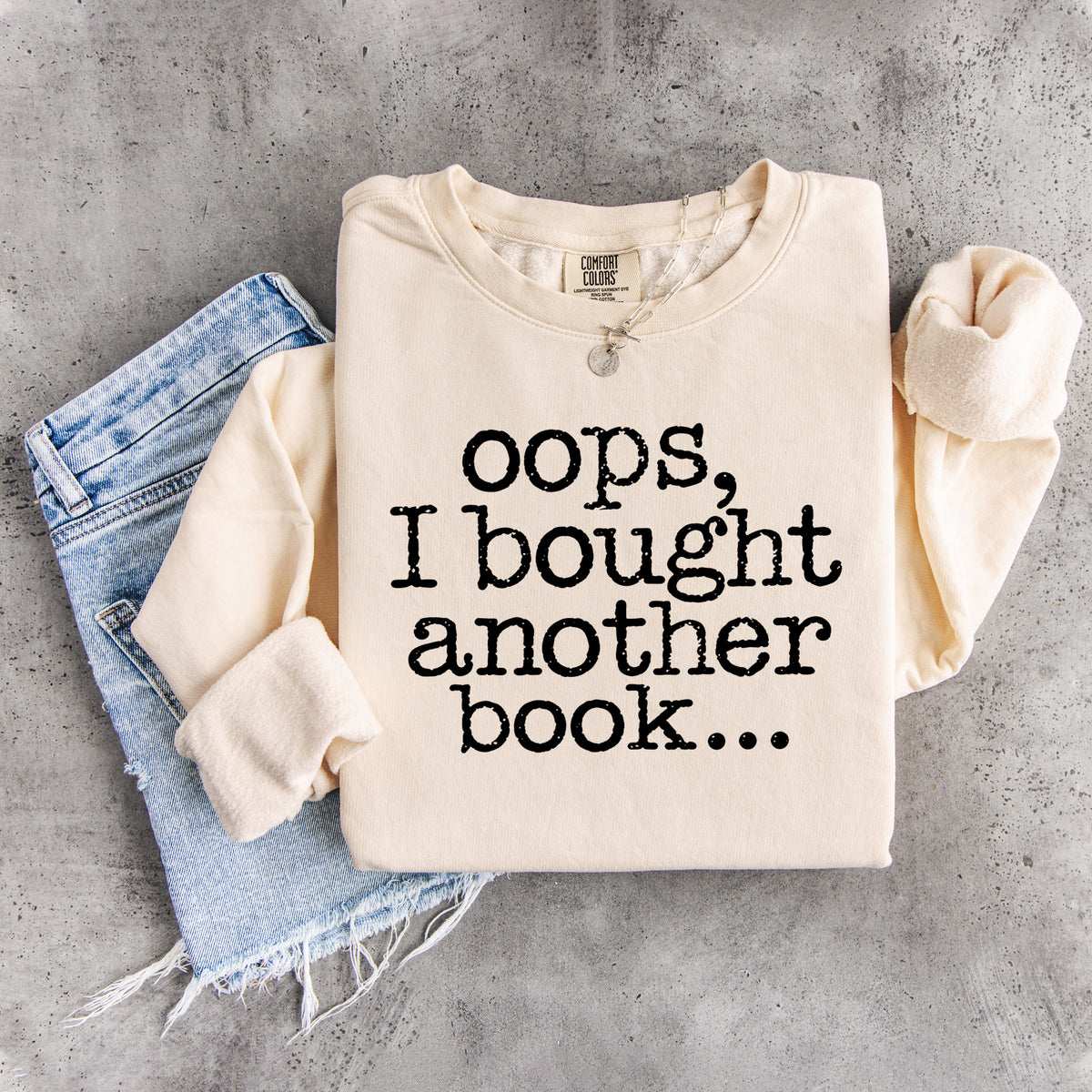 „Ups, ich habe noch ein Buch gekauft …“ – humorvolles Sweatshirt für Bücherwürmer
