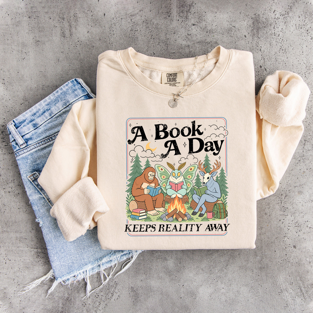 Ein Buch am Tag hält die Realität fern – Sweatshirt
