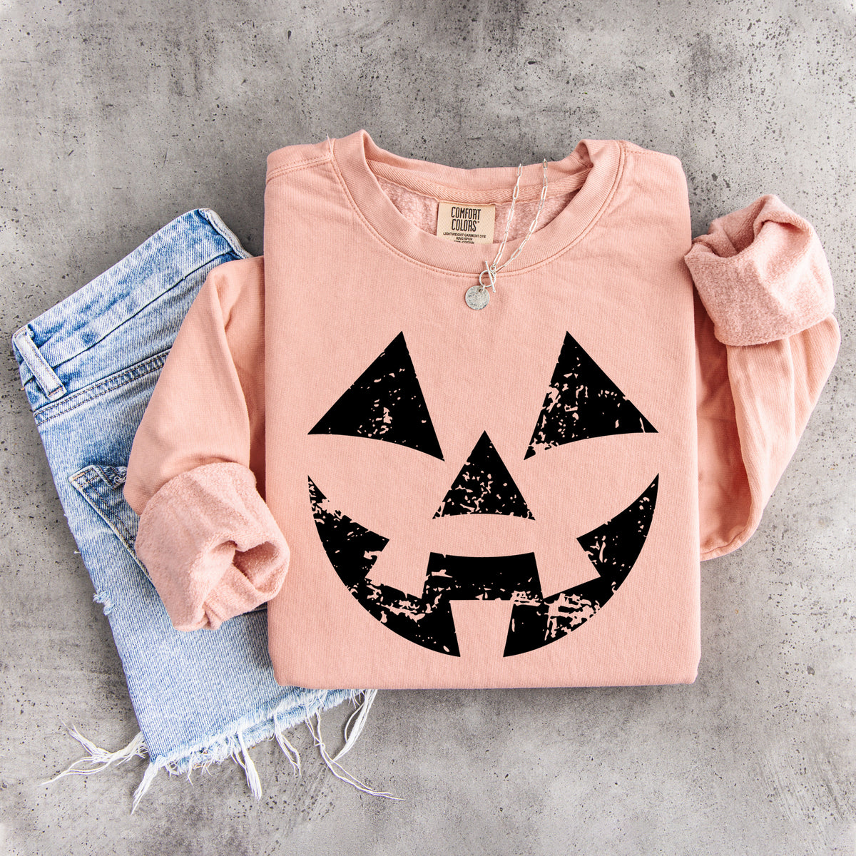 Sudadera con cara de calabaza desgastada