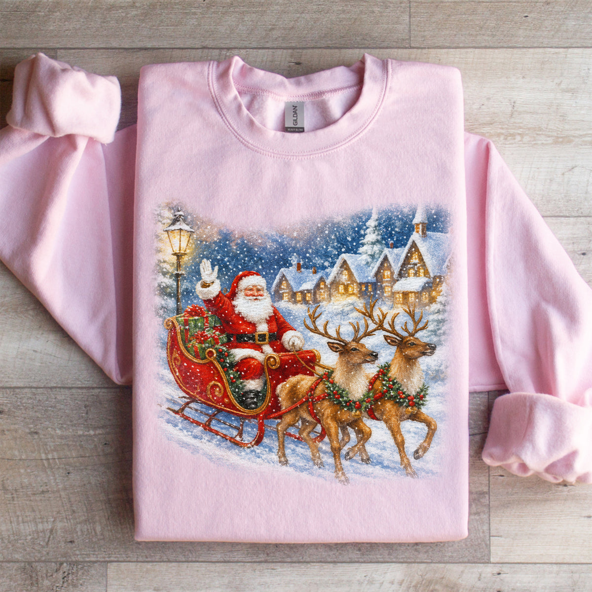 Retro Santa Claus Christmas Sweatshirt Pink fleece crewneck with vintage storybook Santa in sleigh graphic