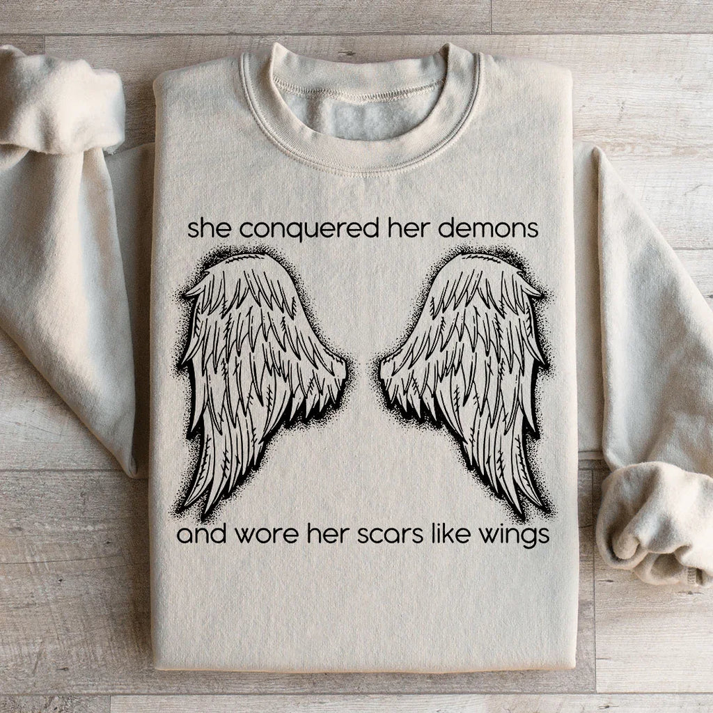 She Conquered Her Demons And Wore Her Scars Like Wings Sweatshirt
