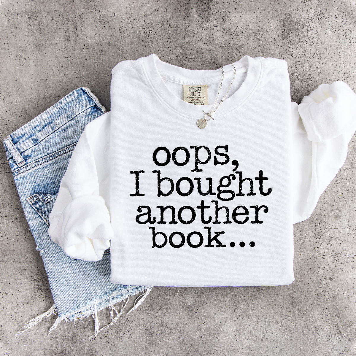 „Ups, ich habe noch ein Buch gekauft …“ – humorvolles Sweatshirt für Bücherwürmer