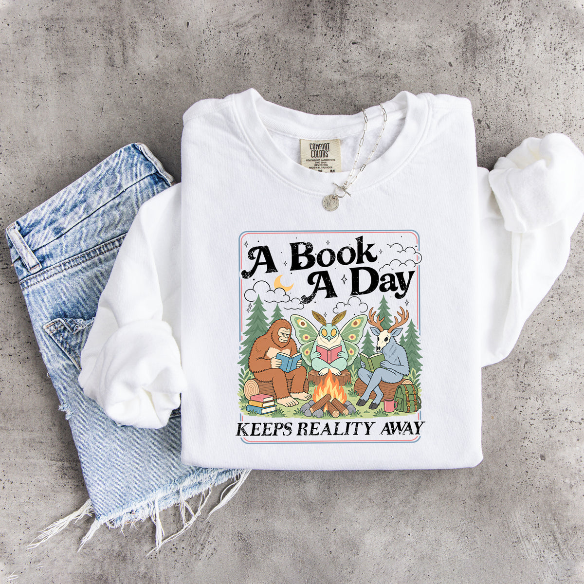 Ein Buch am Tag hält die Realität fern – Sweatshirt
