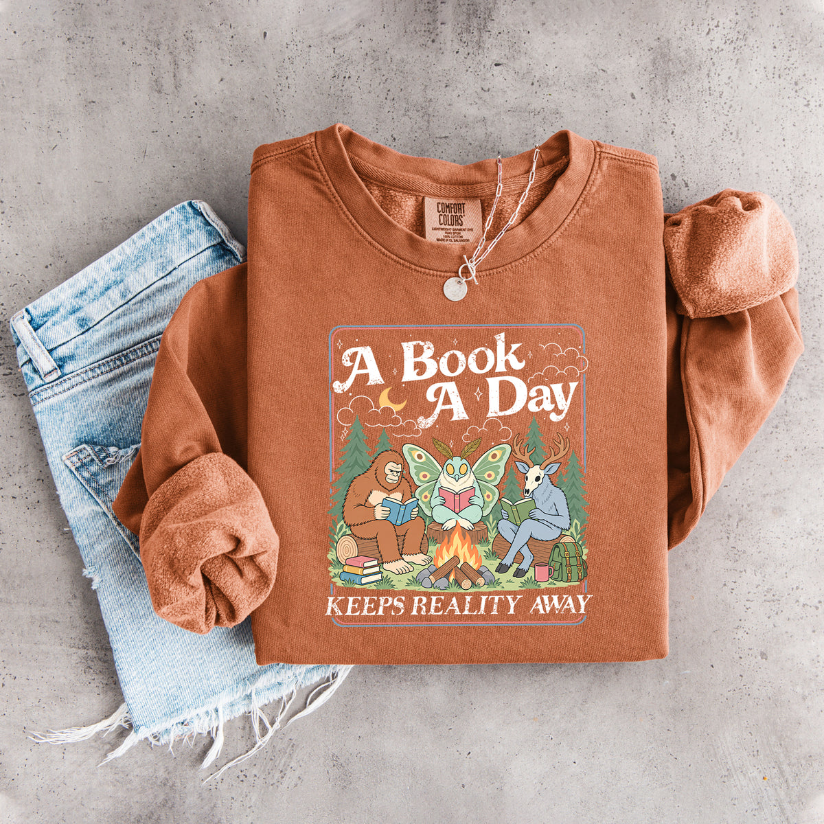 Ein Buch am Tag hält die Realität fern – Sweatshirt