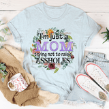 I'm Just A Mom Trying Not To Raise Assholes Tee Heather Prism Ice Blue / S Peachy Sunday T-Shirt