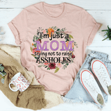 I'm Just A Mom Trying Not To Raise Assholes Tee Heather Prism Peach / S Peachy Sunday T-Shirt