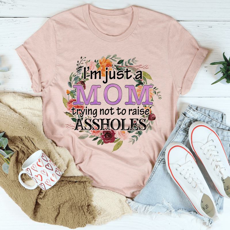 I'm Just A Mom Trying Not To Raise Assholes Tee Heather Prism Peach / S Peachy Sunday T-Shirt
