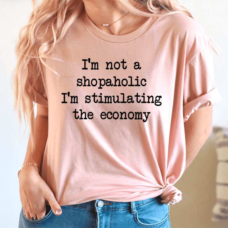 I'm Not A Shopaholic I'm Stimulating The Economy Tee Heather Prism Peach / S Peachy Sunday T-Shirt