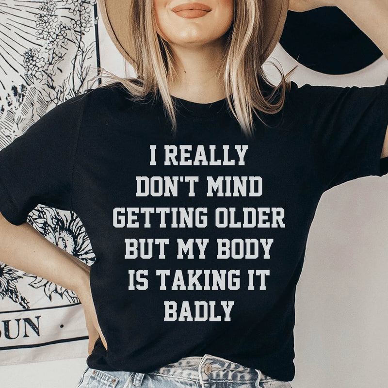 I Really Don't Mind Getting Older But My Body Is Taking It Badly Tee Black Heather / S Peachy Sunday T-Shirt