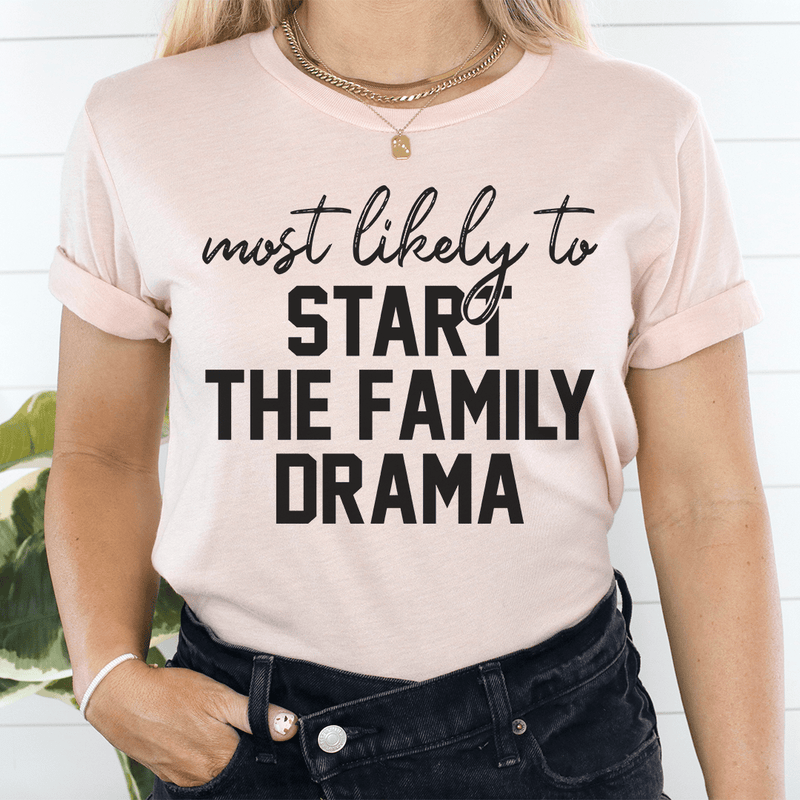 Most Likely To Start The Family Drama Tee Heather Prism Peach / S Peachy Sunday T-Shirt